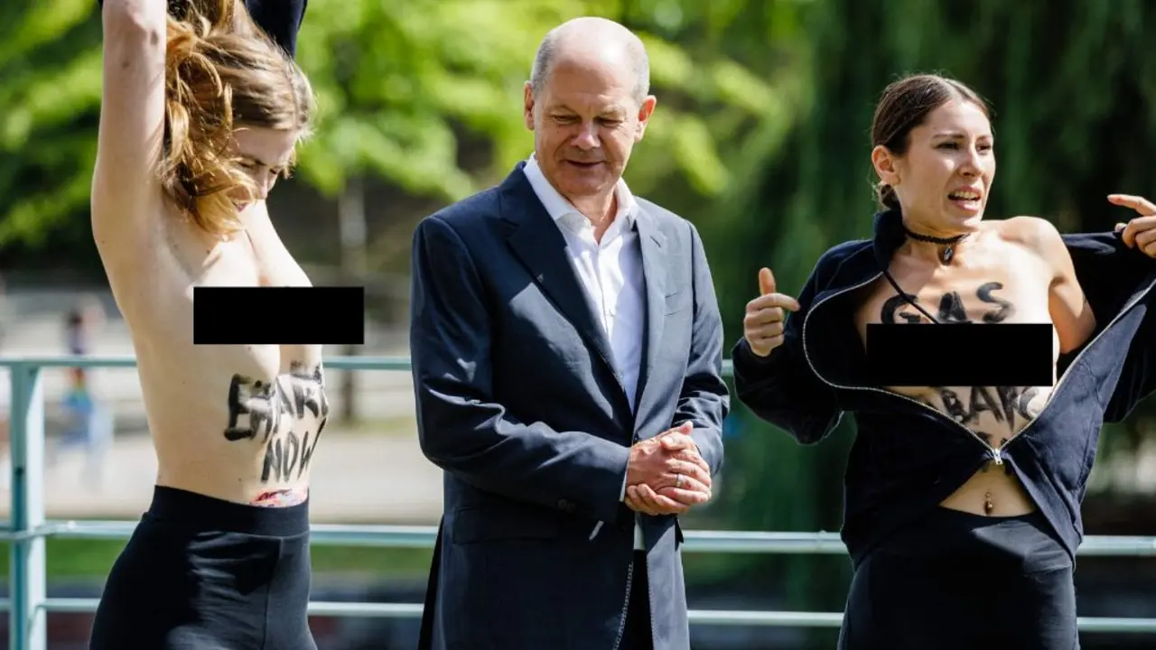 German chancellor caught by surprise by topless protesters